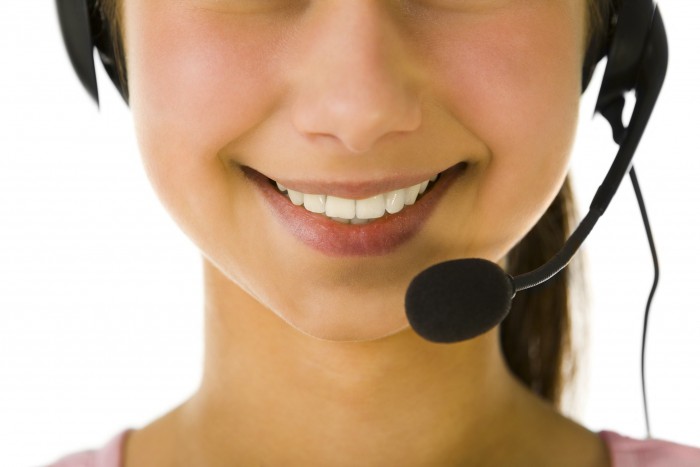 Young woman using headset